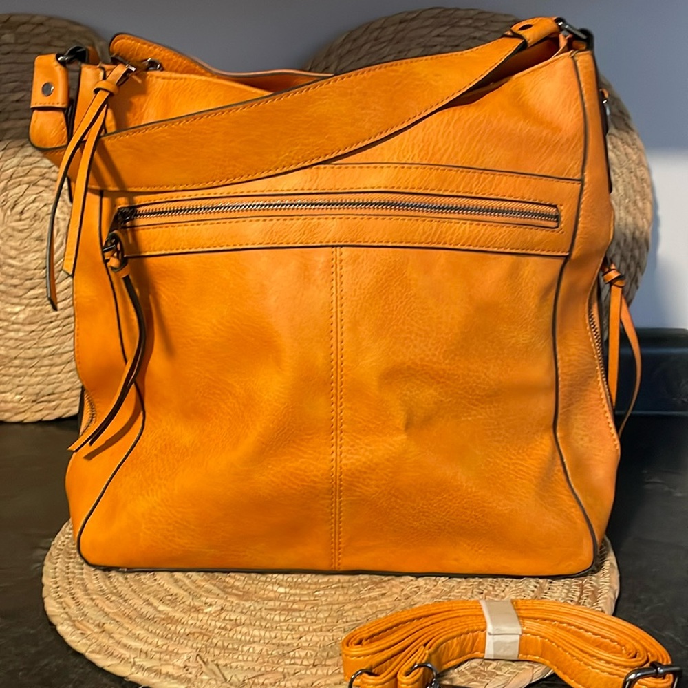 Roulens  Handbag 6 different zipper compartments. Never used